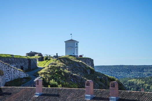 The bell tower freshly painted. The purpose of the bell tower was to warn in case of fire or a surprise attack.  Image is shot at Fredriksten fortress in Halden, Norway a day in September