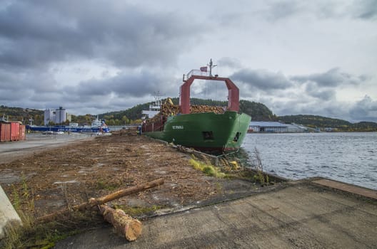 MV St.pauli leaving Halden, (Norway) harbor with a cargo full of timber. Photo is shot 9 October 2013. Vessel's Details: Ship type: General cargo, Year Built: 1983, Length x breadth: 92 m X 15 m, Gross Tonnage: 3075, Dead Weight: 3219 t, Flag: Gibraltar (GI).