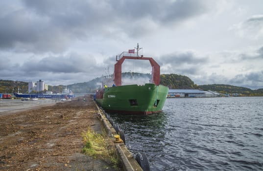 MV St.pauli leaving Halden, (Norway) harbor with a cargo full of timber. Photo is shot 9 October 2013. Vessel's Details: Ship type: General cargo, Year Built: 1983, Length x breadth: 92 m X 15 m, Gross Tonnage: 3075, Dead Weight: 3219 t, Flag: Gibraltar (GI).