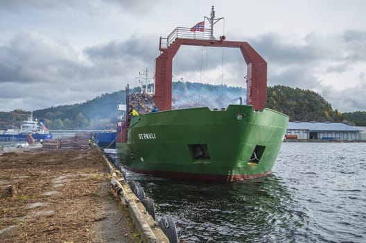 MV St.pauli leaving Halden, (Norway) harbor with a cargo full of timber. Photo is shot 9 October 2013. Vessel's Details: Ship type: General cargo, Year Built: 1983, Length x breadth: 92 m X 15 m, Gross Tonnage: 3075, Dead Weight: 3219 t, Flag: Gibraltar (GI).