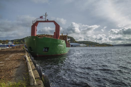 MV St.pauli leaving Halden, (Norway) harbor with a cargo full of timber. Photo is shot 9 October 2013. Vessel's Details: Ship type: General cargo, Year Built: 1983, Length x breadth: 92 m X 15 m, Gross Tonnage: 3075, Dead Weight: 3219 t, Flag: Gibraltar (GI).