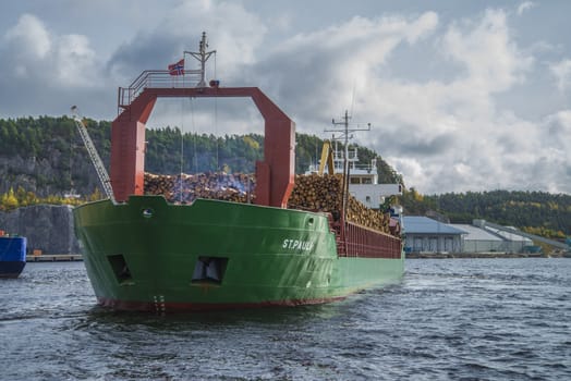 MV St.pauli leaving Halden, (Norway) harbor with a cargo full of timber. Photo is shot 9 October 2013. Vessel's Details: Ship type: General cargo, Year Built: 1983, Length x breadth: 92 m X 15 m, Gross Tonnage: 3075, Dead Weight: 3219 t, Flag: Gibraltar (GI).