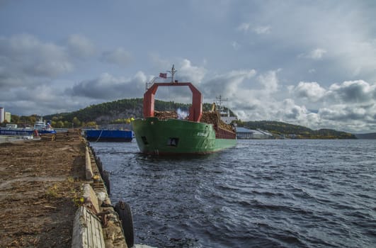 MV St.pauli leaving Halden, (Norway) harbor with a cargo full of timber. Photo is shot 9 October 2013. Vessel's Details: Ship type: General cargo, Year Built: 1983, Length x breadth: 92 m X 15 m, Gross Tonnage: 3075, Dead Weight: 3219 t, Flag: Gibraltar (GI).