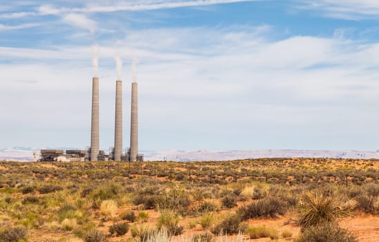 Electrical power station in the middle of a green field