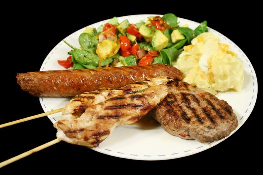 BBQ chicken tenderloin skewers, beef sausage, beef patty with spinach salad and potato salad.