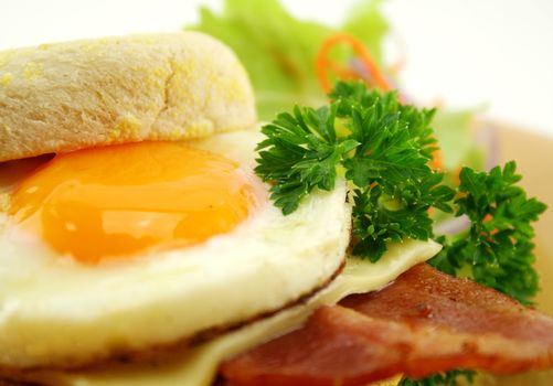 Delicious bacon and egg muffin with cheese ready to serve for breakfast.