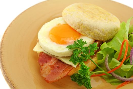 Delicious bacon and egg muffin with cheese ready to serve for breakfast.