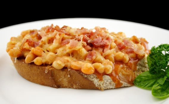 Delicious diced bacon with baked beans on sour dough bread.