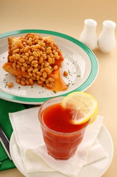 Delicious and simple old fashioned baked beans stack on toast with tomato juice.