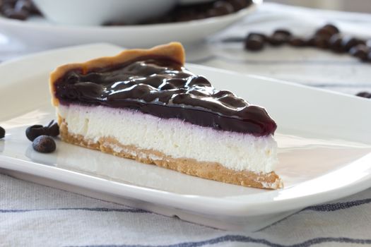 Blueberry cheesecake on white background