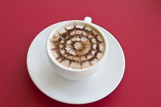 Make coffee latte with cream on red background