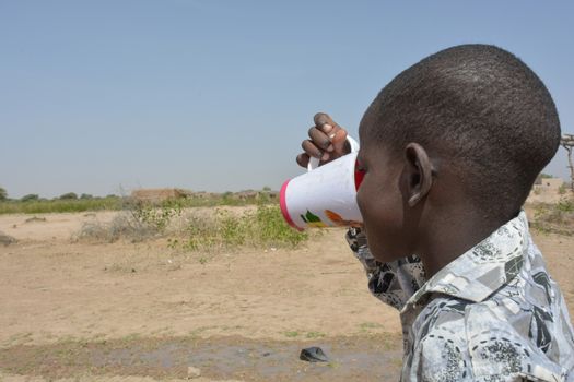 African child drinks water