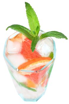 A glass of ice water and grapefruit.
