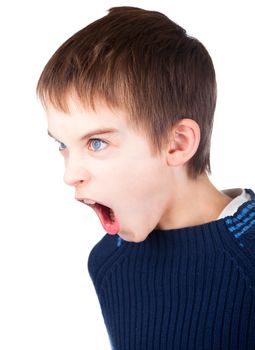 Angry boy wearing blue sweater shouting on white background