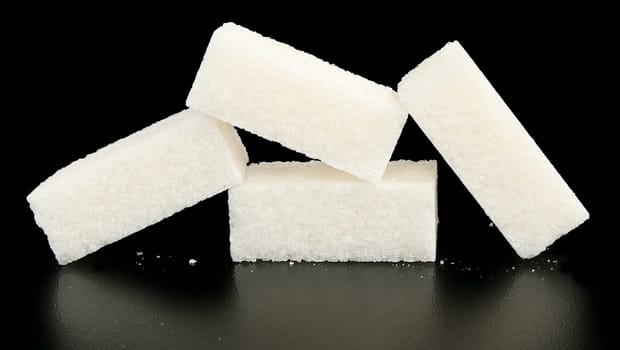 Pieces of sugar on a white background.