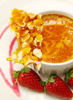 Delicious almond praline and baked custard with fresh strawberries.