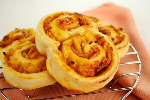 Piping hot baked ham scrolls straight from the oven.