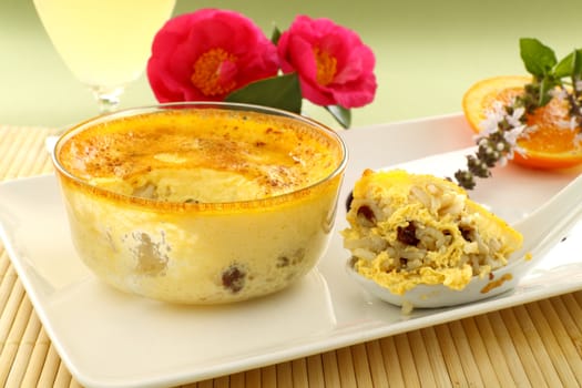 Spoonful of fresh baked rice custard straight from the oven ready to serve.