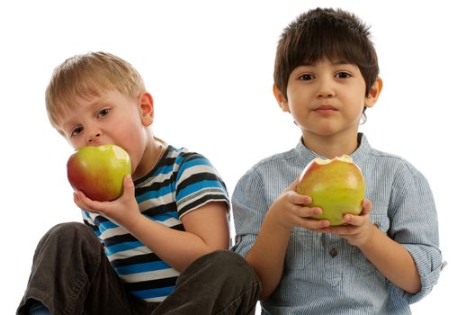 Two Little Boys Eating an Apples