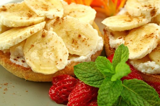 Banana and riccotta muffins with strawberries and mint ready to serve.