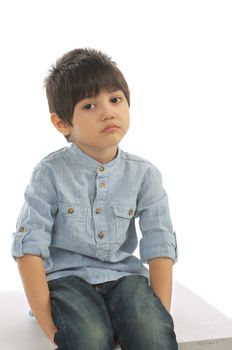 Sad Little Boy in Striped Shirt and Jeans