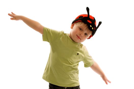 Blonde Little Boy in Ladybird Costume Keeps Hands on Sides Depicts Fly