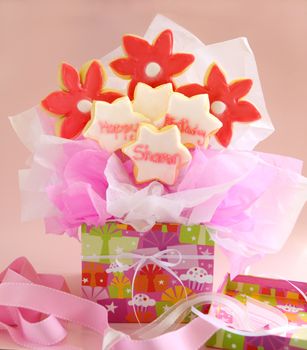 A birthday bouquet made from iced cookies on sticks and gift wrapped.