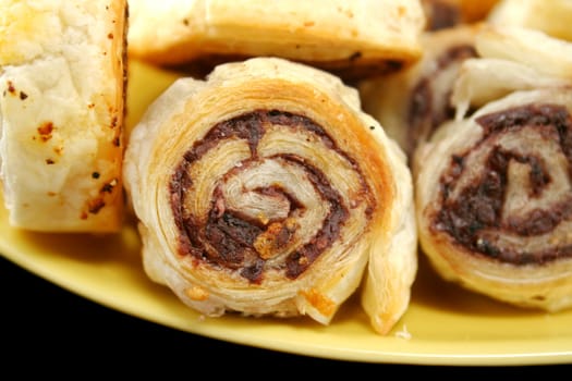 Freshly baked black olive pastries ready to serve.