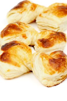 Fluffy Puff Pastry Bakery Bow Shaped In a Row isolated on white background