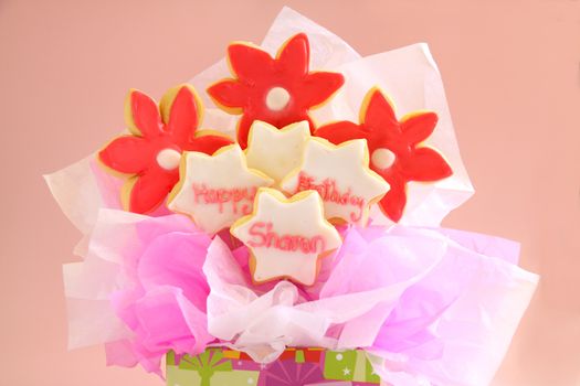 A birthday bouquet made from iced cookies on sticks and gift wrapped.