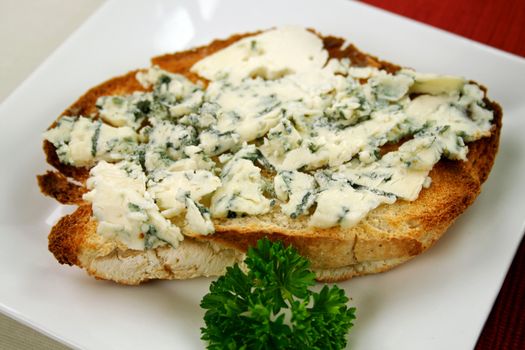 Danish blue cheese spread on to a crisp slice of toast.