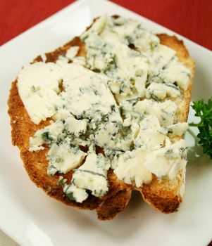 Danish blue cheese spread on to a crisp slice of toast.