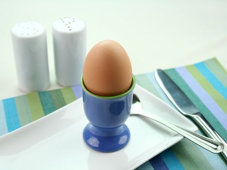 Uncracked boiled egg ready to be broken and served.