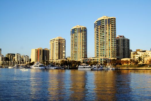 Dockside Marina and apartments in Brisbane Australia seen from the river in the early morning light.