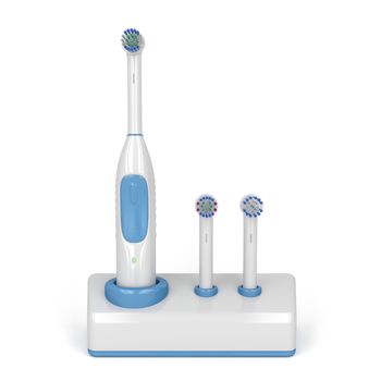 Electric toothbrush on stand with two spare brushes