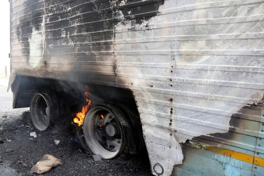 Truck trailor disastor with burning wheels from over heated brakes