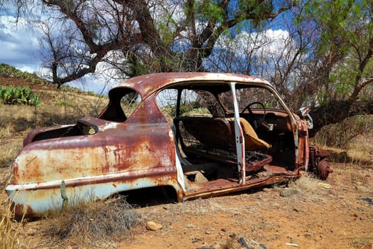 Old deserted wreck of a car in the Karoo in South Africa