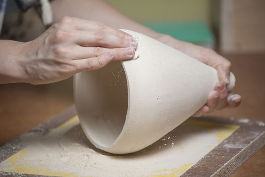 Girl make toyfrom clay. High resolution image.