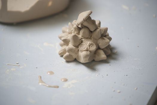 Girl make toyfrom clay. High resolution image.