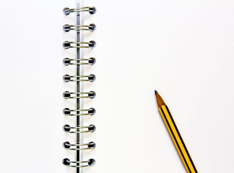 open blank notepad with rings and pencil