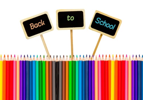 colored pencils with a little black boards isolated on white