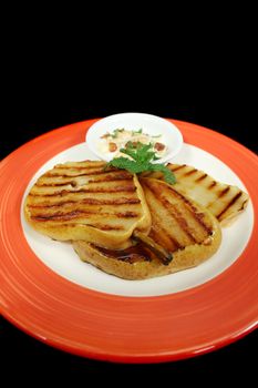 Chargrilled pears with sultana, coconut and mint yoghurt.