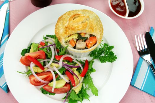 Home style chicken and vegetable pies with salad