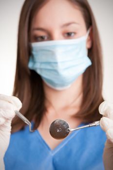 Closeup of a dentist hands about to do a procedure on a patient