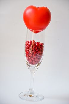 red pill in glass on white background