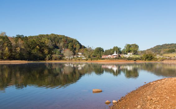 This is a tranquil scene of a lake and small group of buildings along Highway 64 in North Carolina.