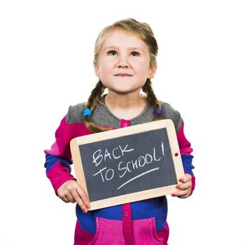 happy school girl with a traditionnal slate in his hands