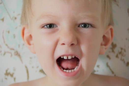 Portrait of cute boy with blue eyes