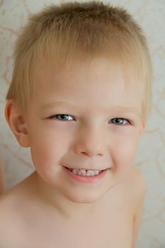 Portrait of cute boy with blue eyes