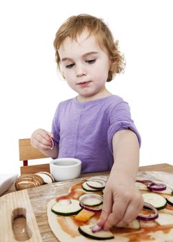 girl making fresh pizza in white background. wide angle studio shot